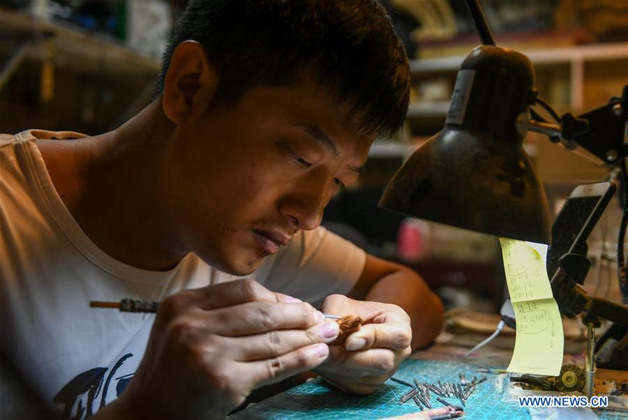 CHINA-INNER MONGOLIA-CHIFENG-FRUIT PIT-CARVING (CN)