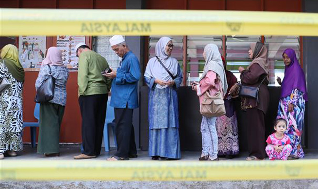 Malaysians vote in highly-contested election