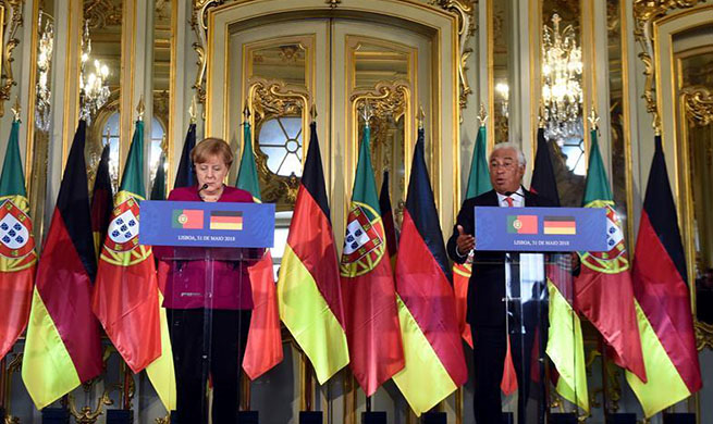 German, Portuguese leaders promise united European response to U.S. trade tariffs