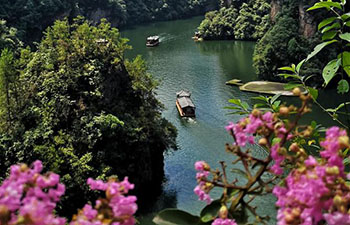 Tourists go sightseeing on boat in Zhangjiajie, China's Hunan